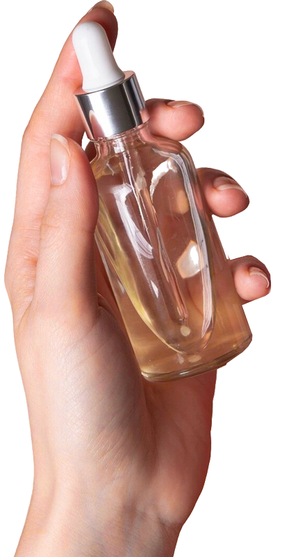 mano di donna con flacone olio
